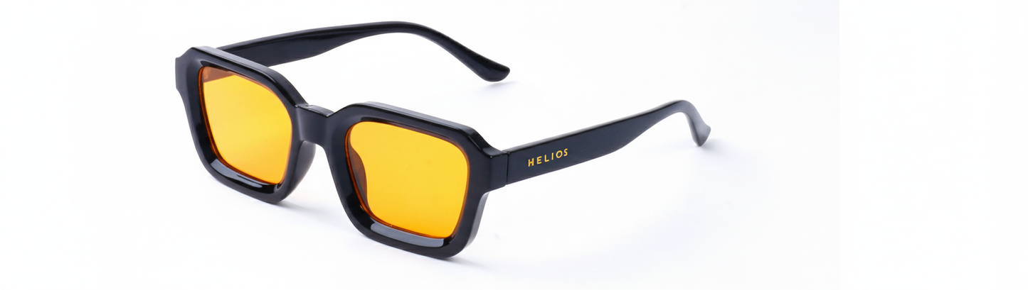Sunglasses with yellow lenses and black frames on a white background